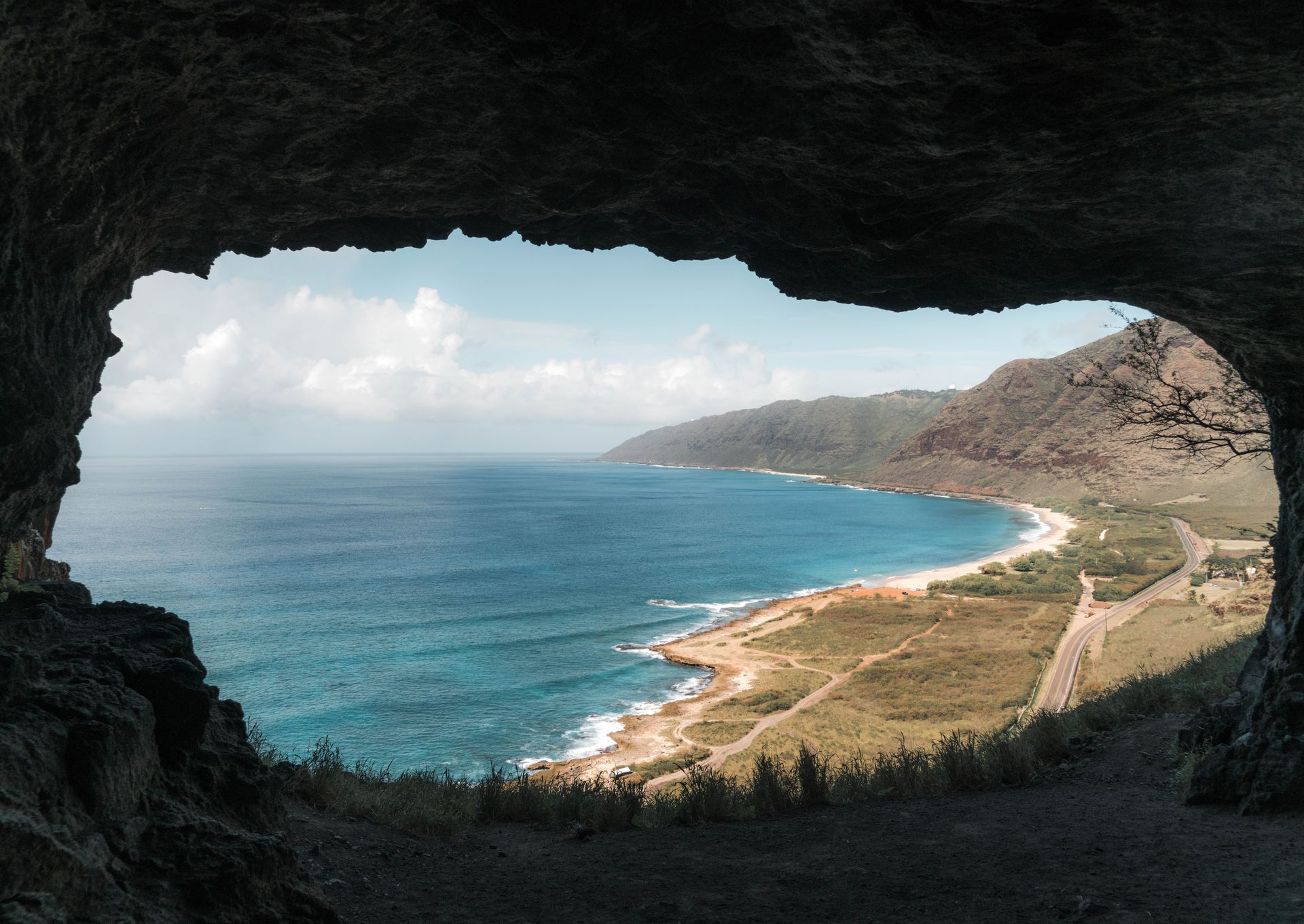 The view of Oahu's rugged western coastline looking out from the Kaneana Cave near Waianae, Hawaii