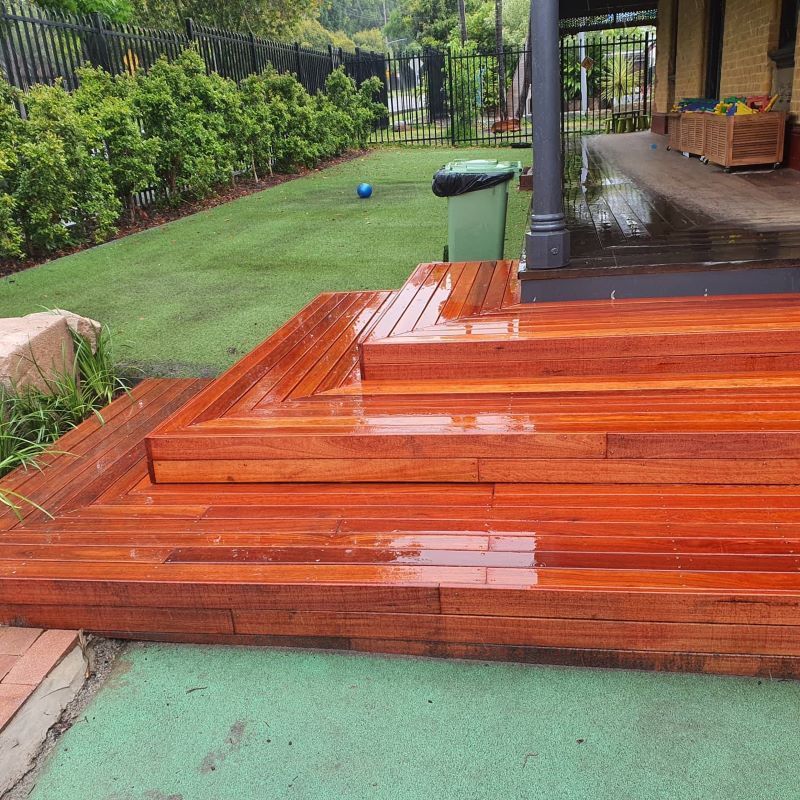 A Wooden Deck With Stairs Leading Up to It — Garden Vogue in Charlestown, NSW