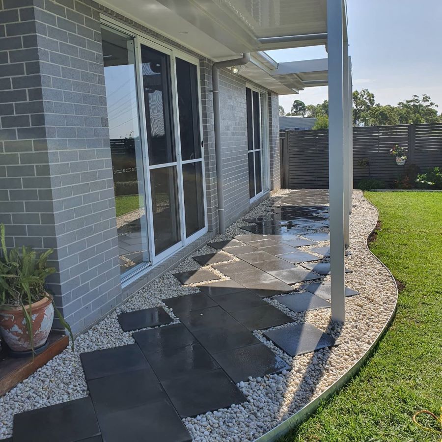 A Brick House With a Walkway Leading to It — Garden Vogue in Charlestown, NSW