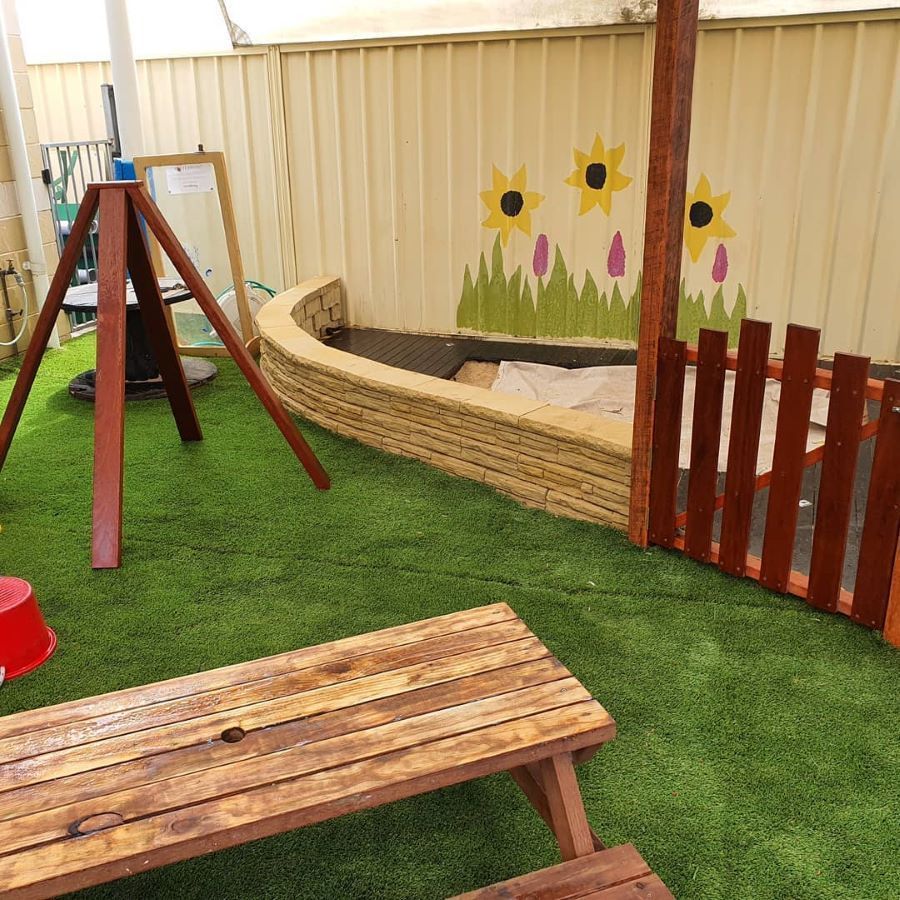 A Wooden Picnic Table is Sitting in Front of a Sandbox — Garden Vogue in Charlestown, NSW