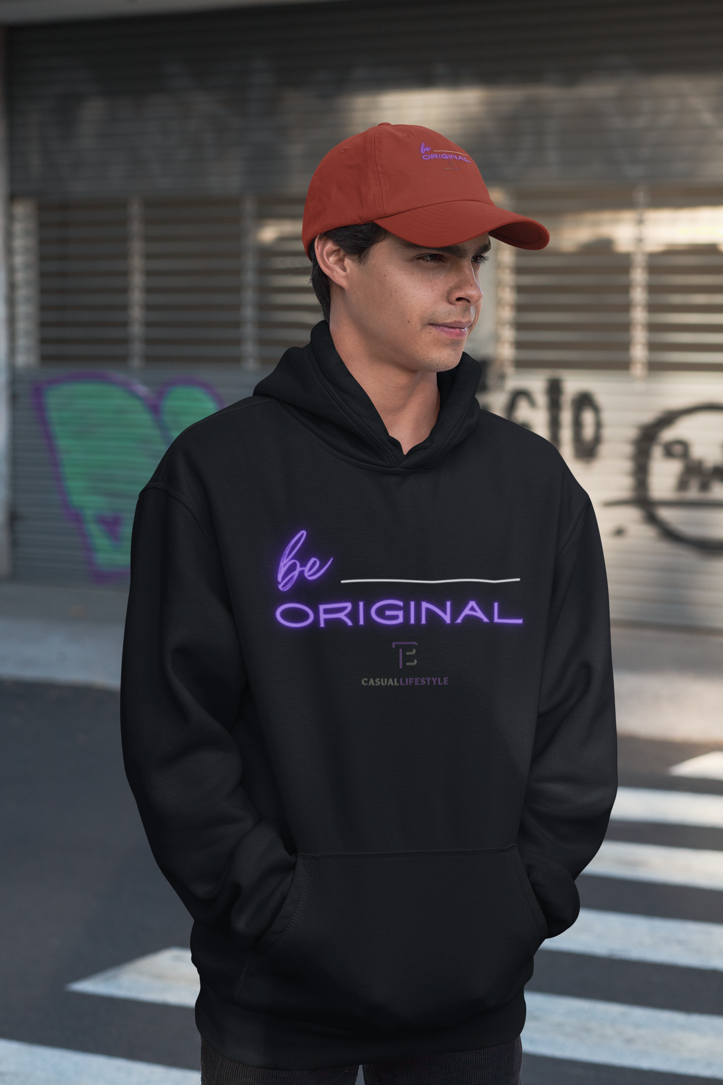 Man in black hoodie and red cap, 