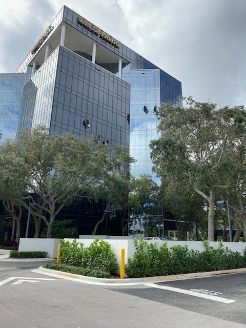 Man Cleaning The Window — Boca Raton, FL — J & B Window Cleaning of South Florida