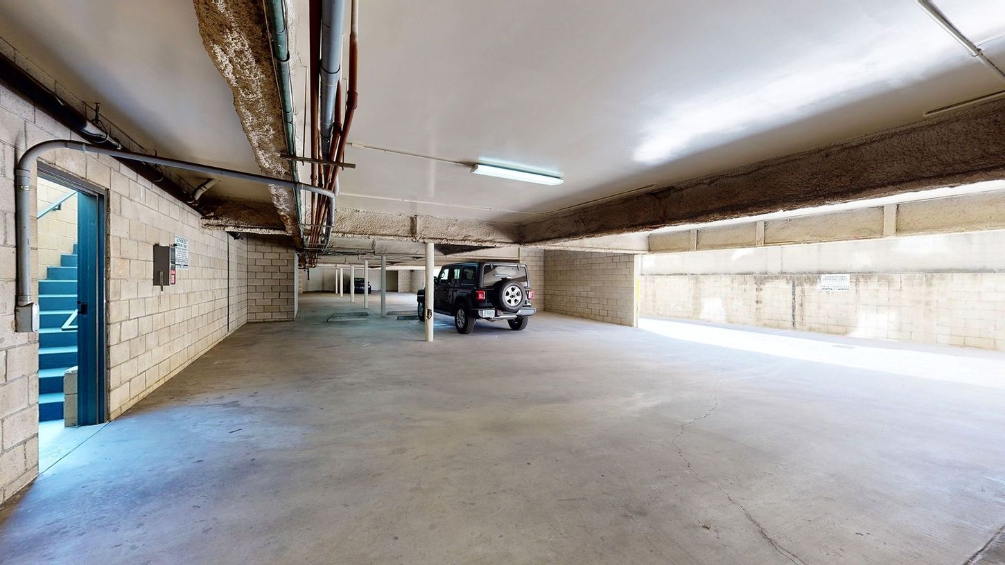 A car is parked in a parking garage.
