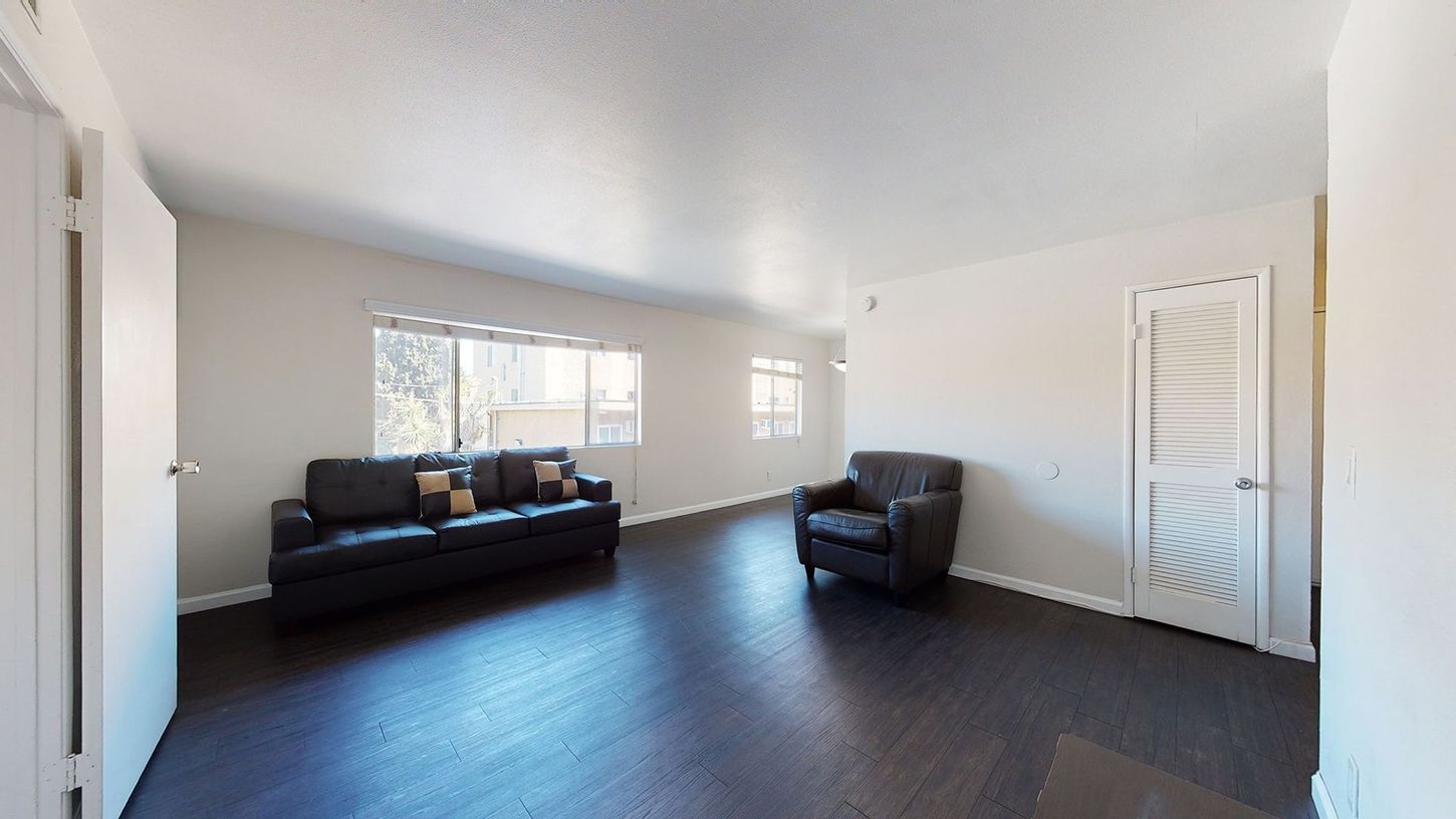 There is a couch and a chair in the living room.