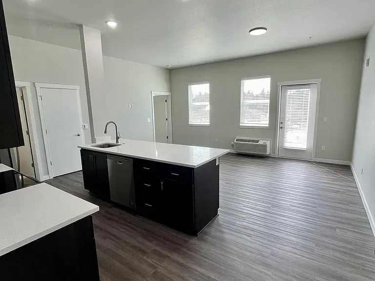 There is a large island in the middle of the room.