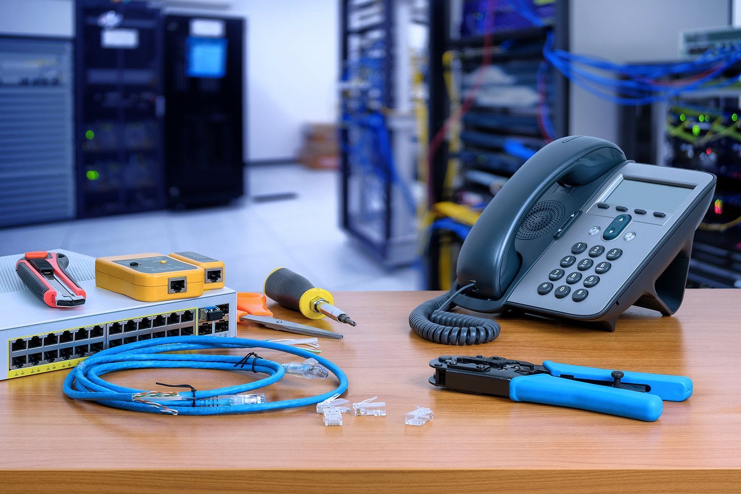 Desk with network equipment and phone