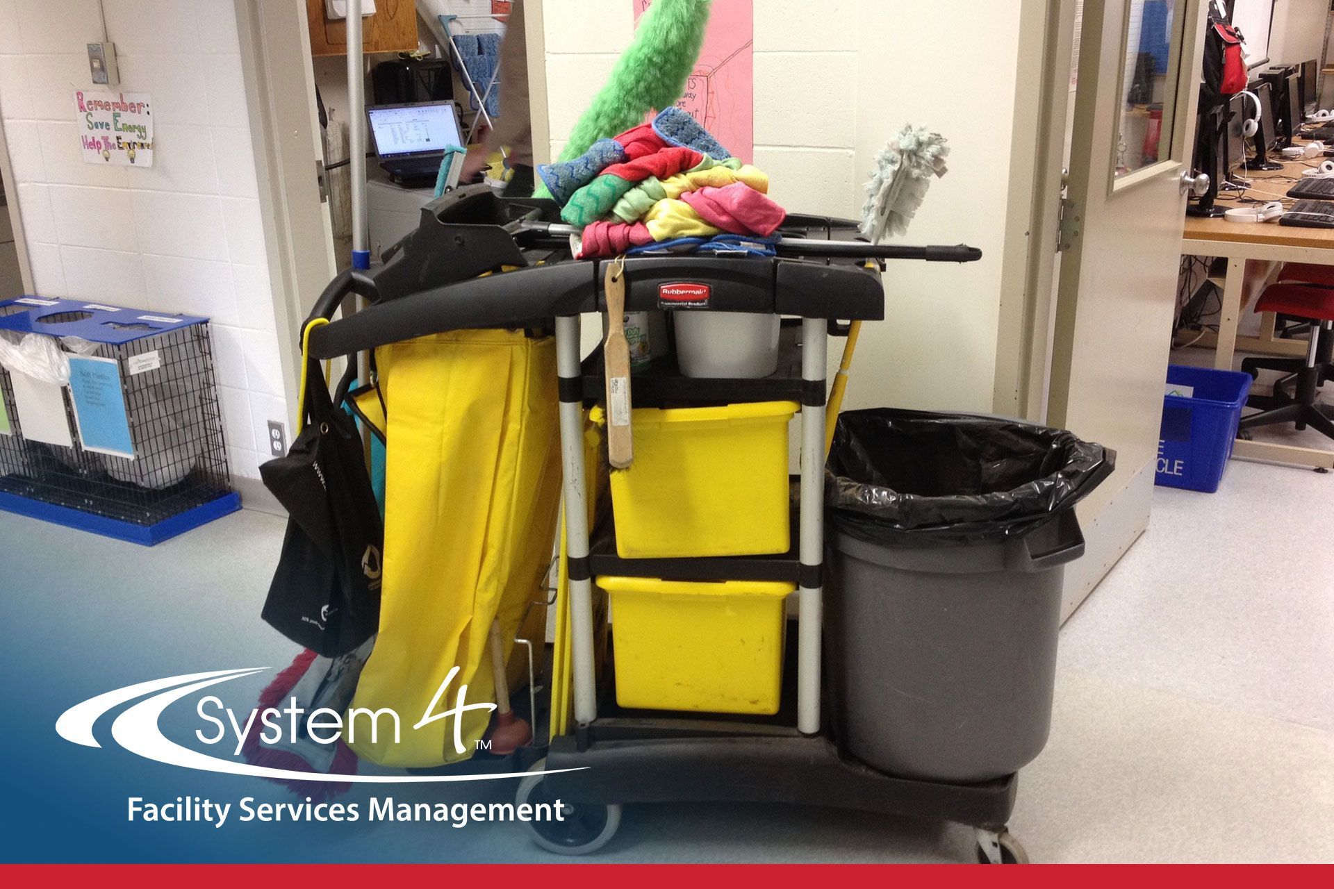 Janitorial cart with mop, cleaning supplies, yellow bags, and trash can in a hallway