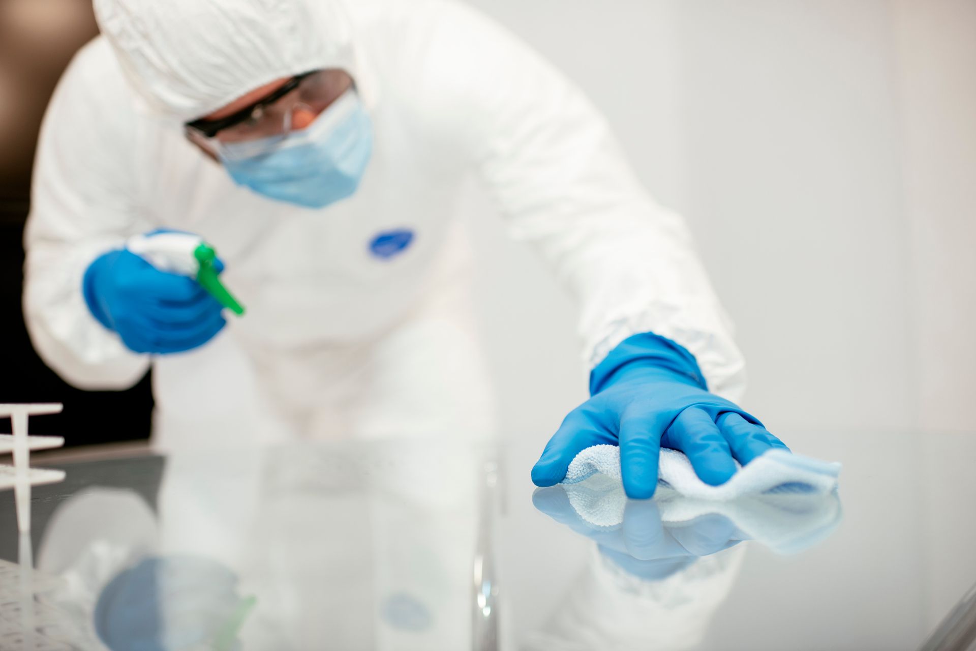Professional cleanroom cleaning crew in sterile protective gear