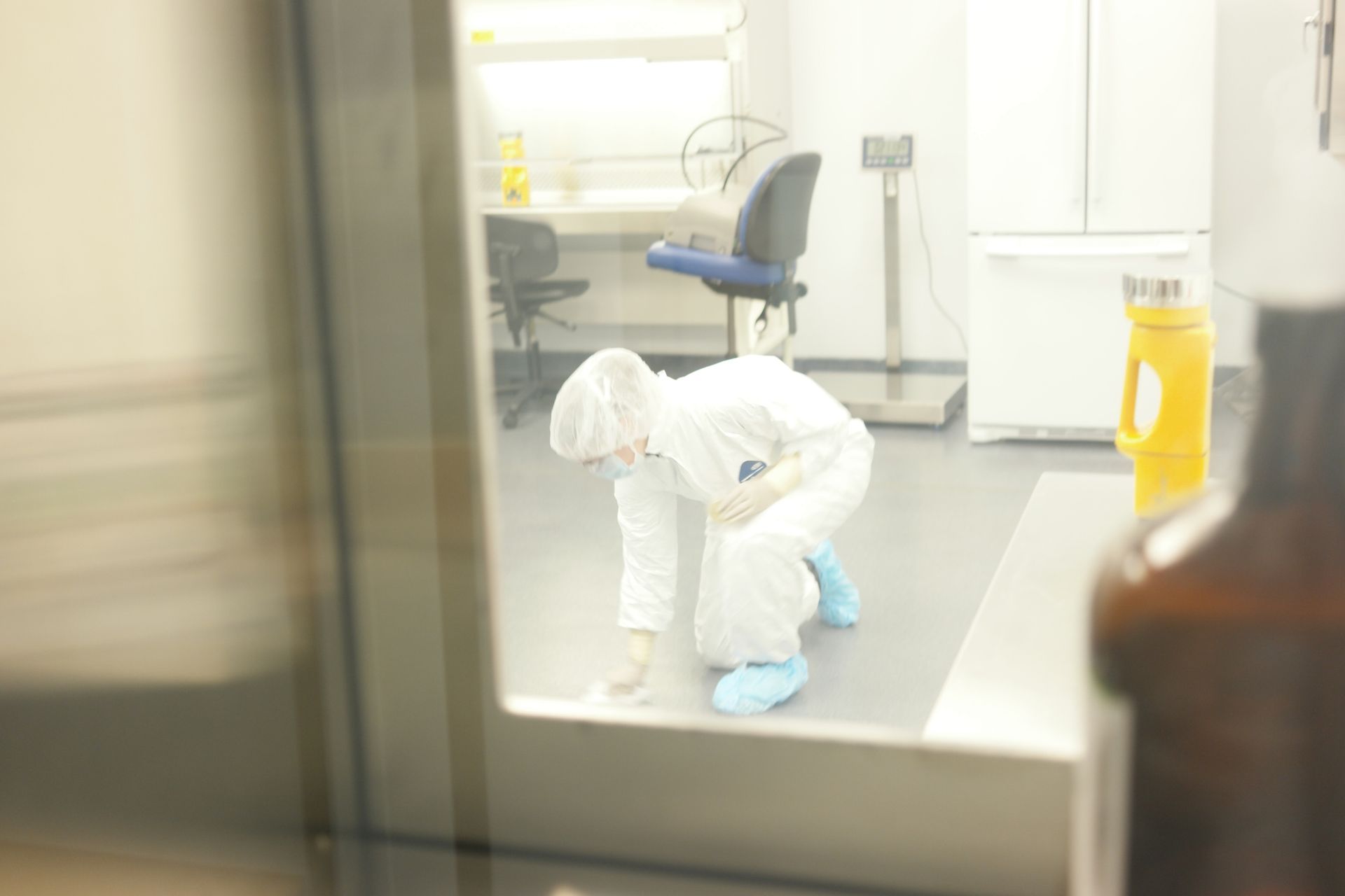 Professional cleanroom cleaning crew in sterile protective gear