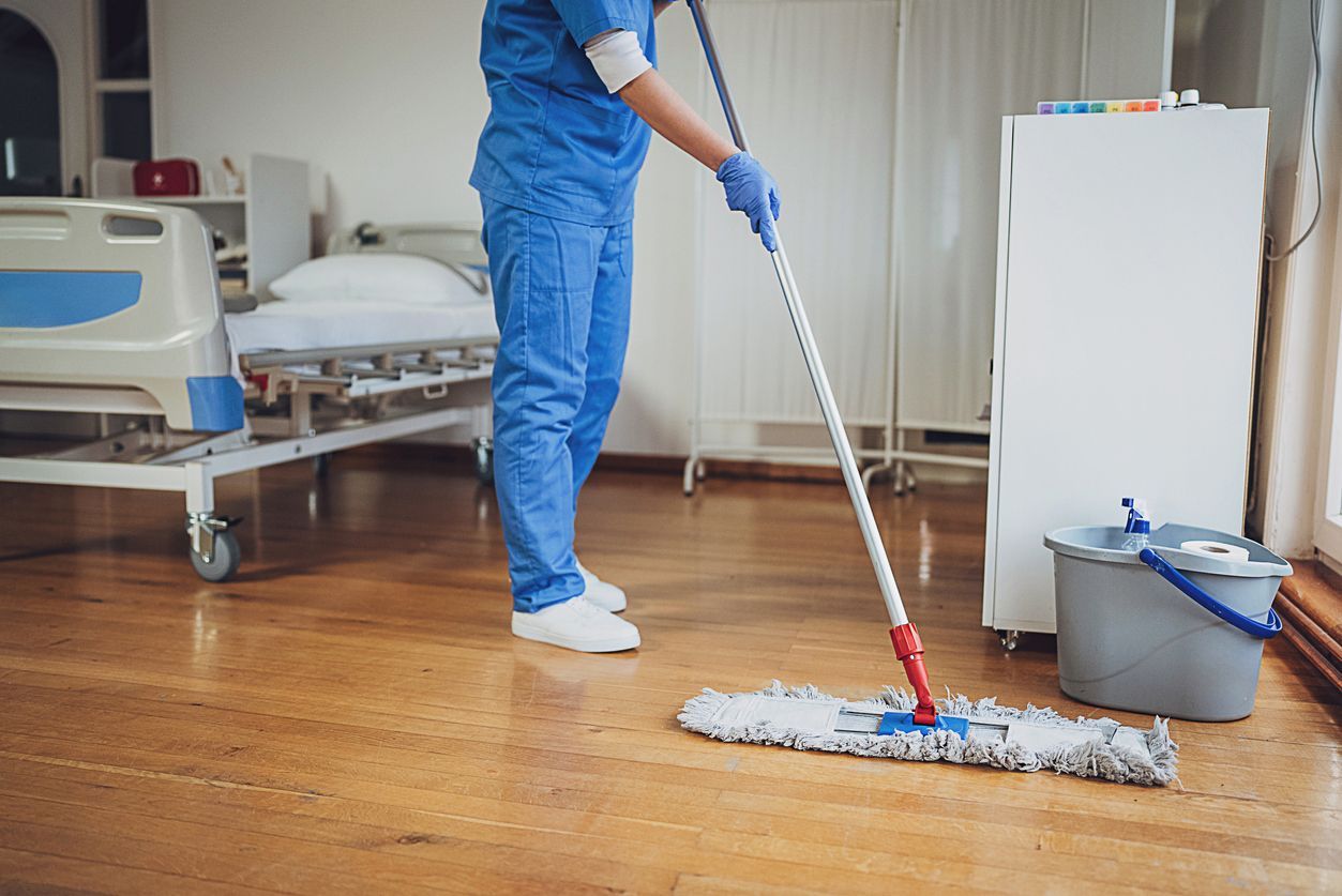 Certified technician performing high-level disinfection in a healthcare facility