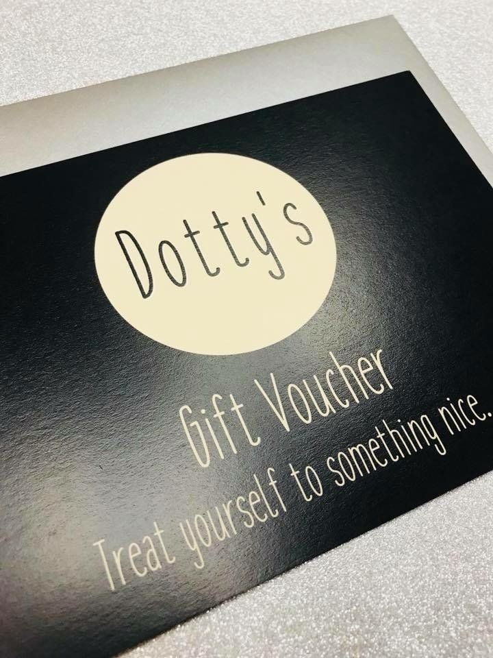 Dotty's gift voucher on a black background, with a cream circle logo. Text:
