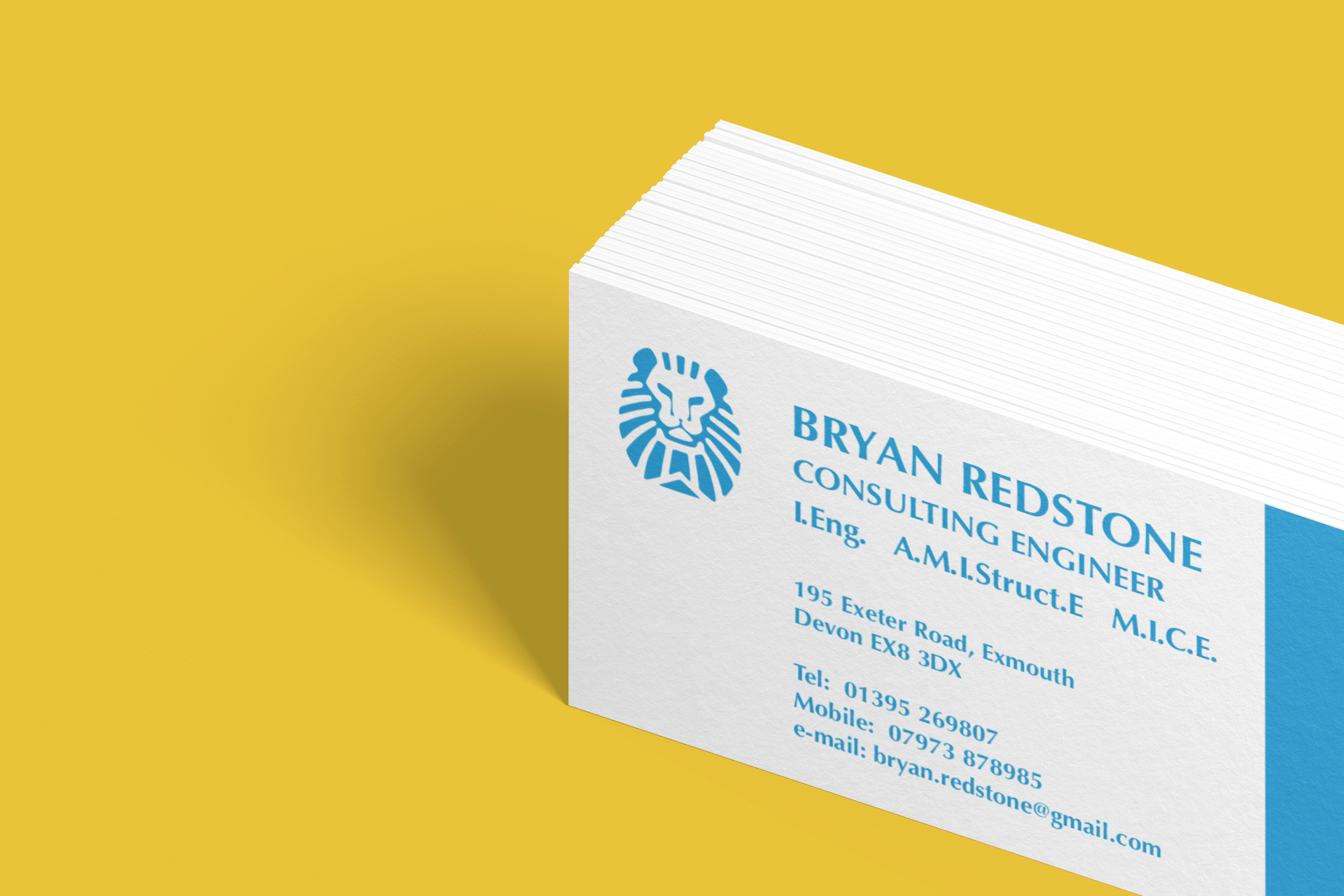 Business cards with the name Bryan Redstone and lion logo, on a yellow background.