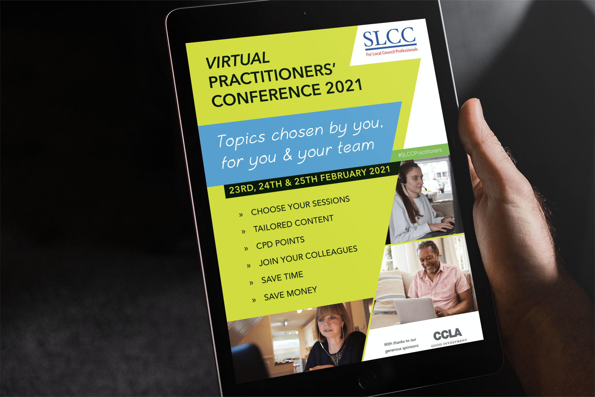 A hand holding a tablet displaying a conference flyer with the title 