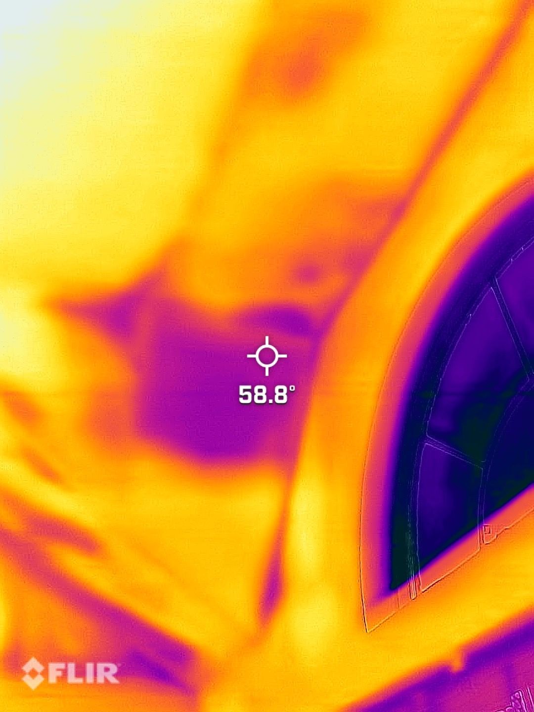 Thermal FLIR view of a hot metal surface and pipe, showing a 58.8° reading.