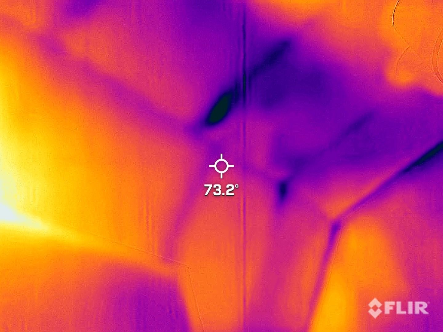 FLIR thermal view of a surface with purple and orange heat patterns, showing 73.2°F at center