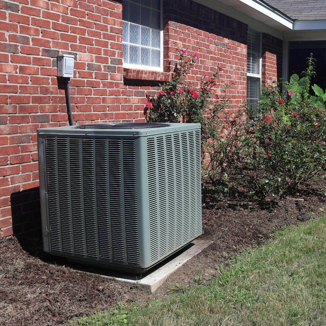 Learn More About Amana HVAC Units An Amana air conditioning Unit is sitting outside of a brick house after being installed by Phil's Heating and Air
