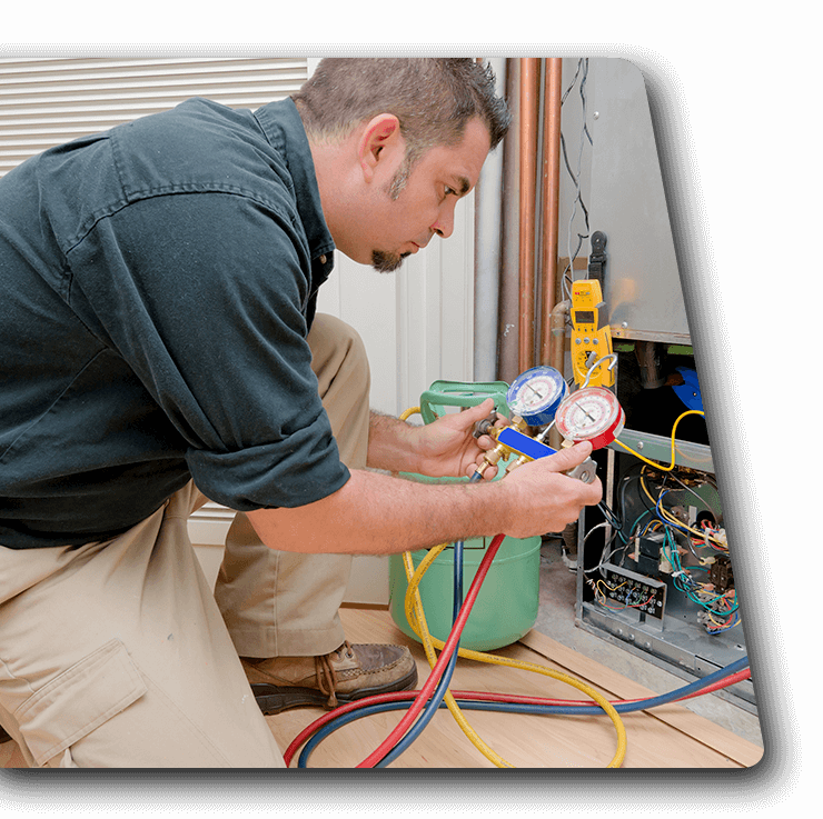 Contact Us Technician checking HVAC unit with gauges and hoses outdoors
