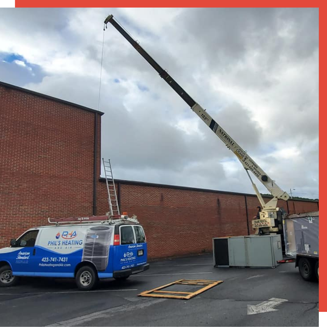 Contact Us Blue service van and crane lifting a gray container beside a brick building under cloudy skies.