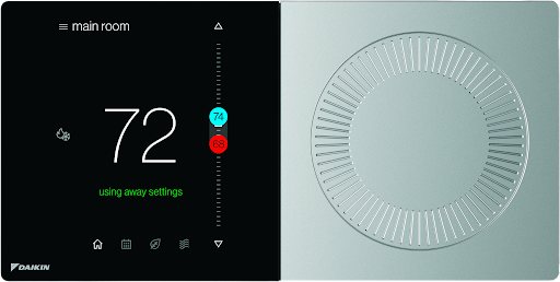 Smart thermostat display showing 72° with a temperature dial on the right side, black and silver design