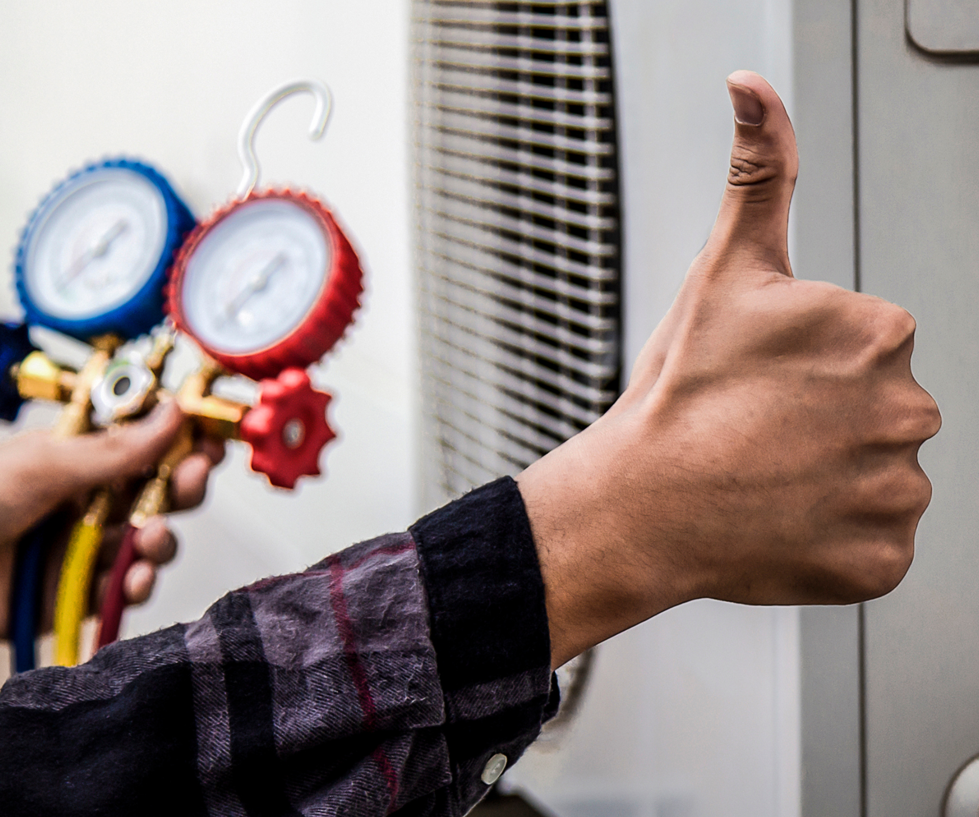 Contact Us Hand giving a thumbs-up beside HVAC gauges and a vent