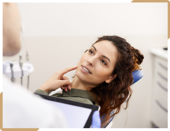 Patient discussing dental treatment with her dentist at Ethos Dental Studio in Langley, BC