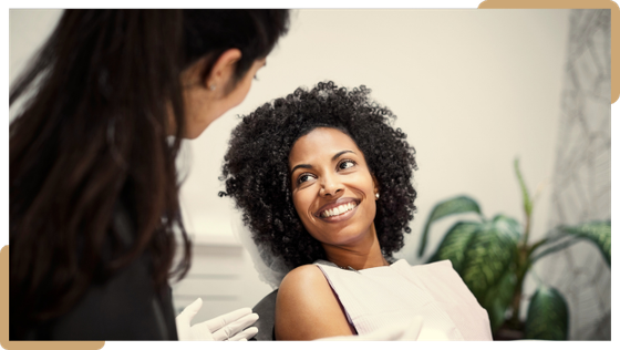 Table Patient smiling during a dental appointment at Ethos Dental Studio in Langley, BC