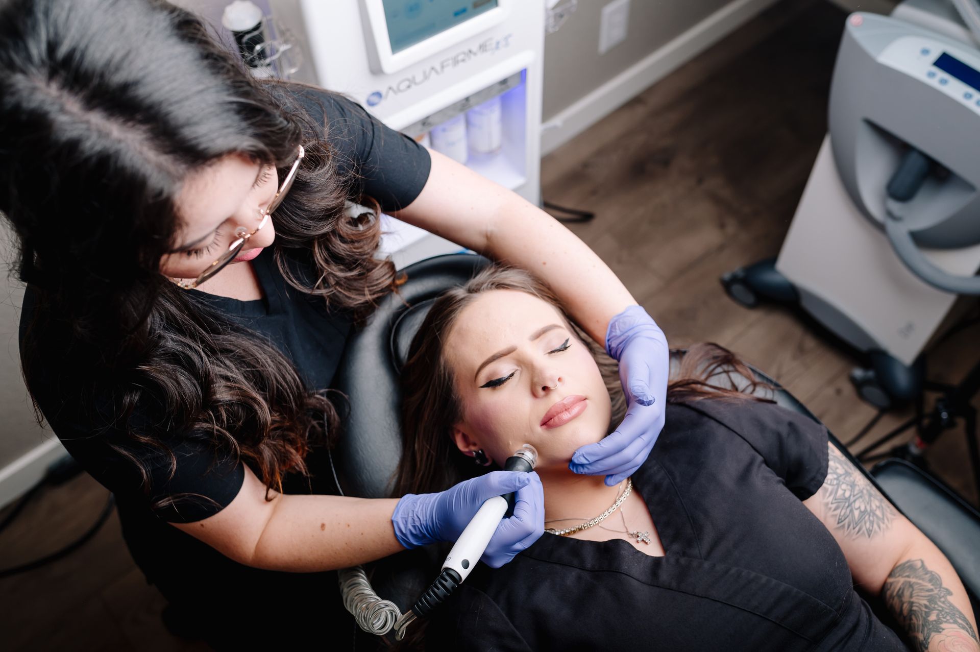 A woman is getting a facial treatment at a beauty salon.