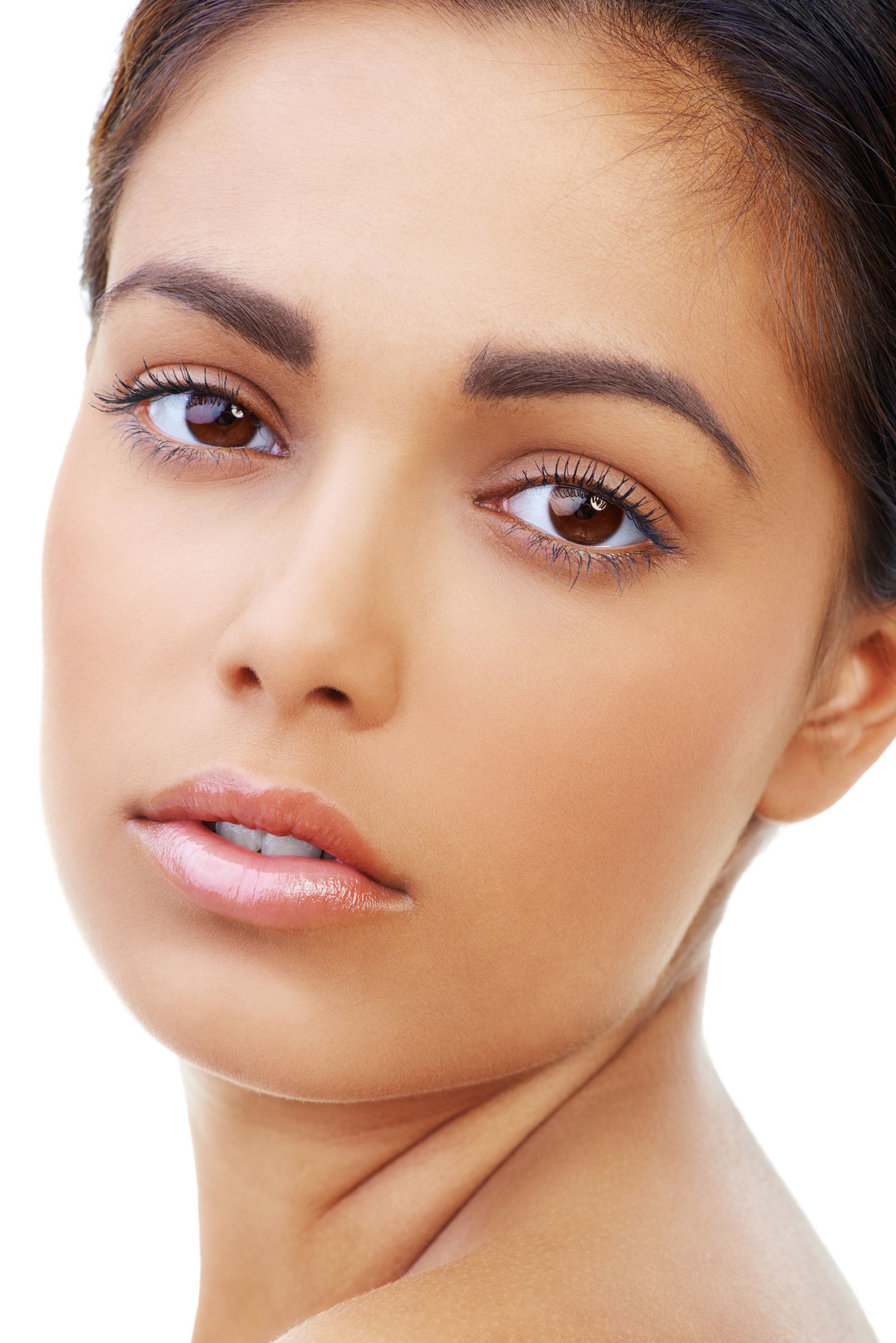 A close up of a woman 's face with her hand on her neck