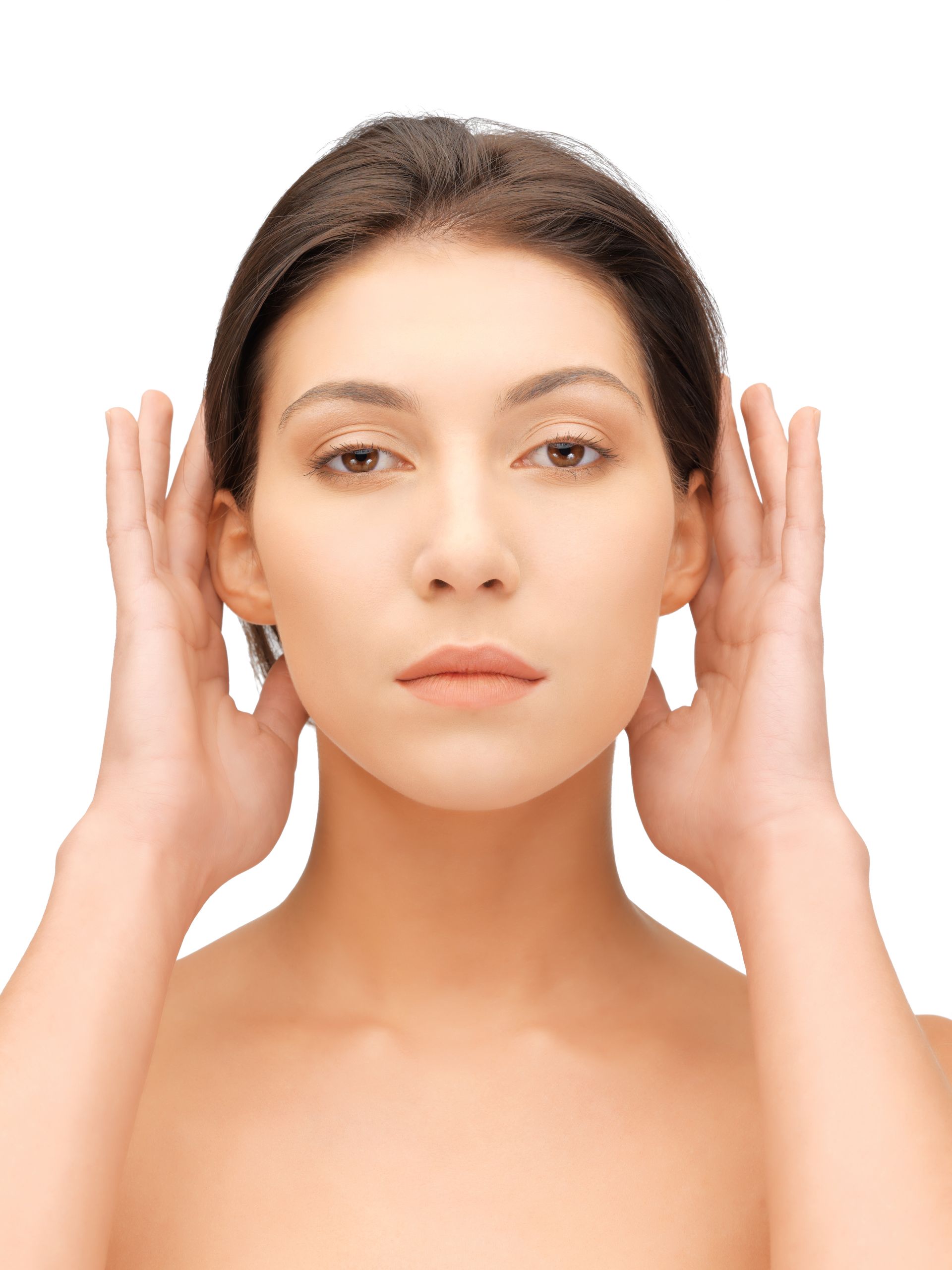 A woman is covering her ears with her hands.