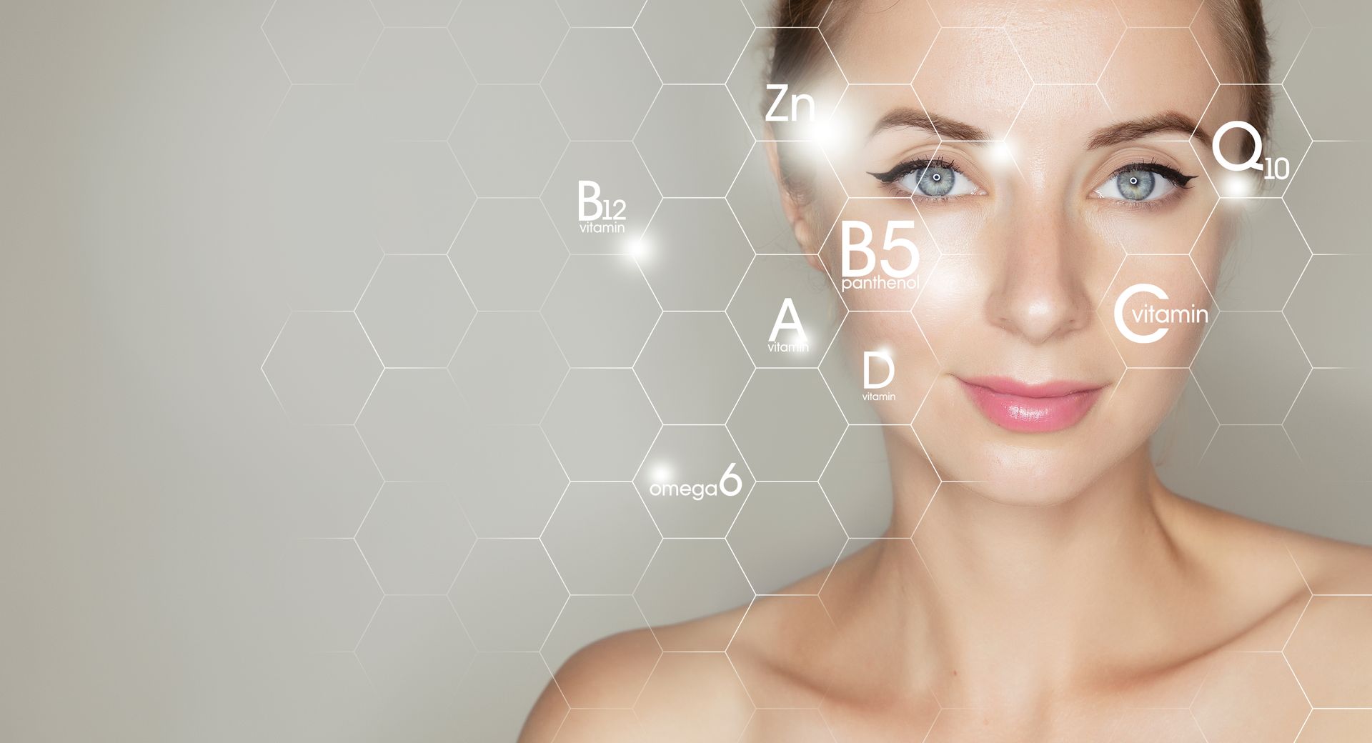 A close up of a woman 's face with vitamins on it.
