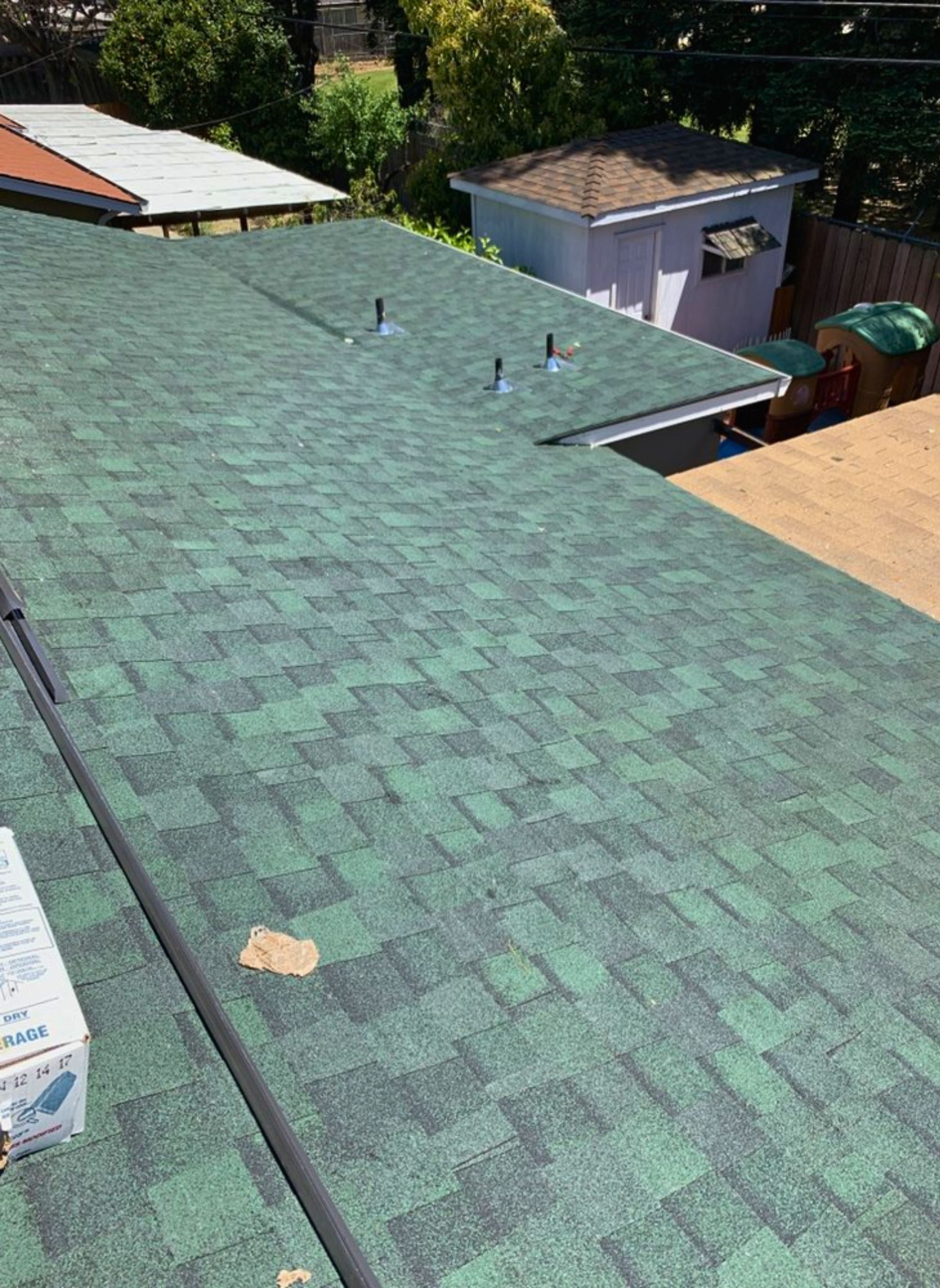 A green roof is being installed on a house.