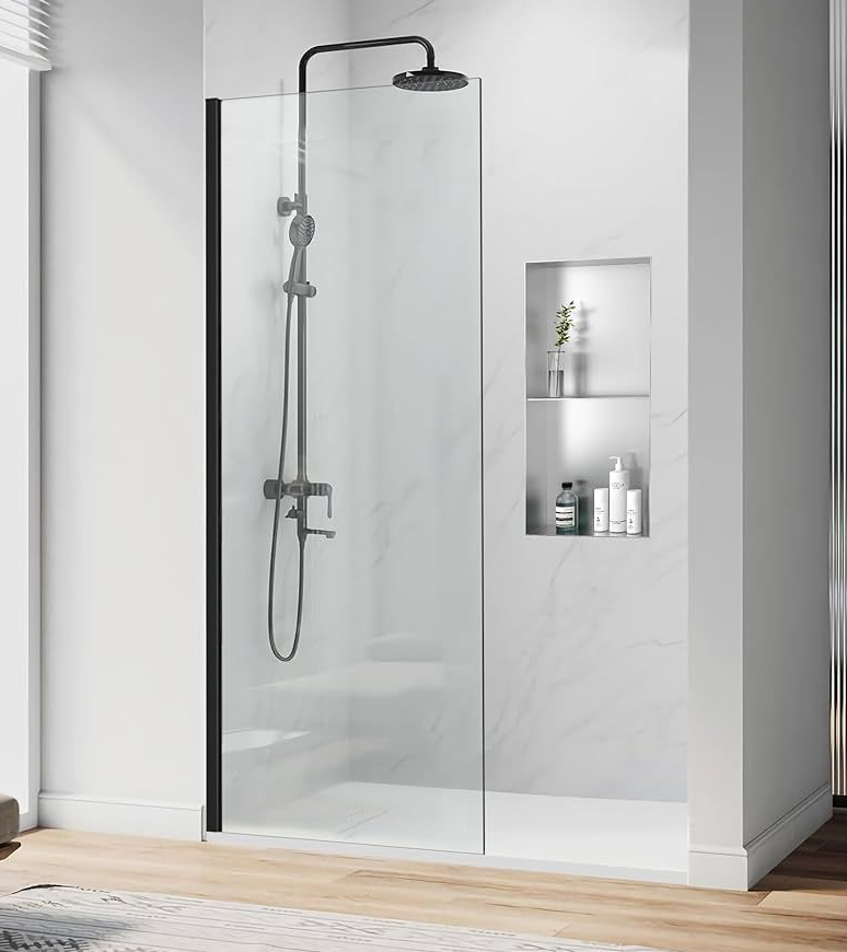 Bathroom with white shower and toilet, wood-look floor tiles, white vanity, and light blue walls.