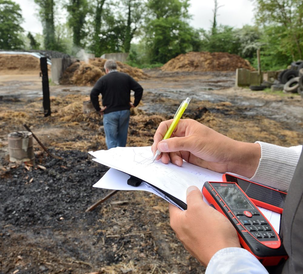 Farm Insurance Agent Calculating Damage Cost to Farm