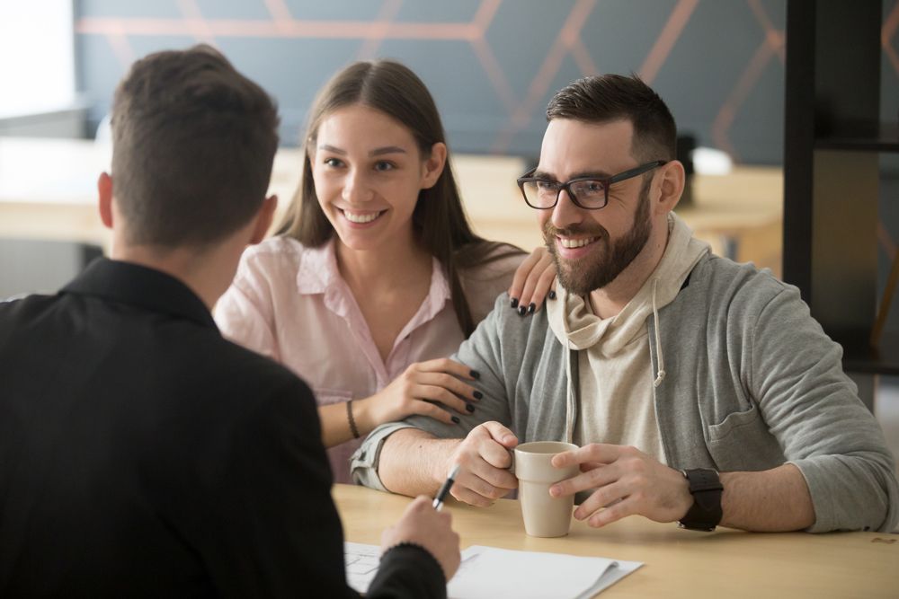 Life Insurance Agent Talking to Clients