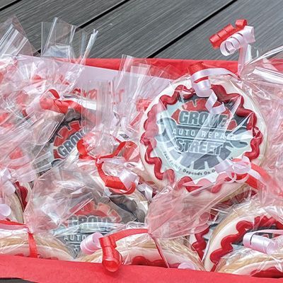a bunch of cookies are wrapped in plastic and sitting on a table .