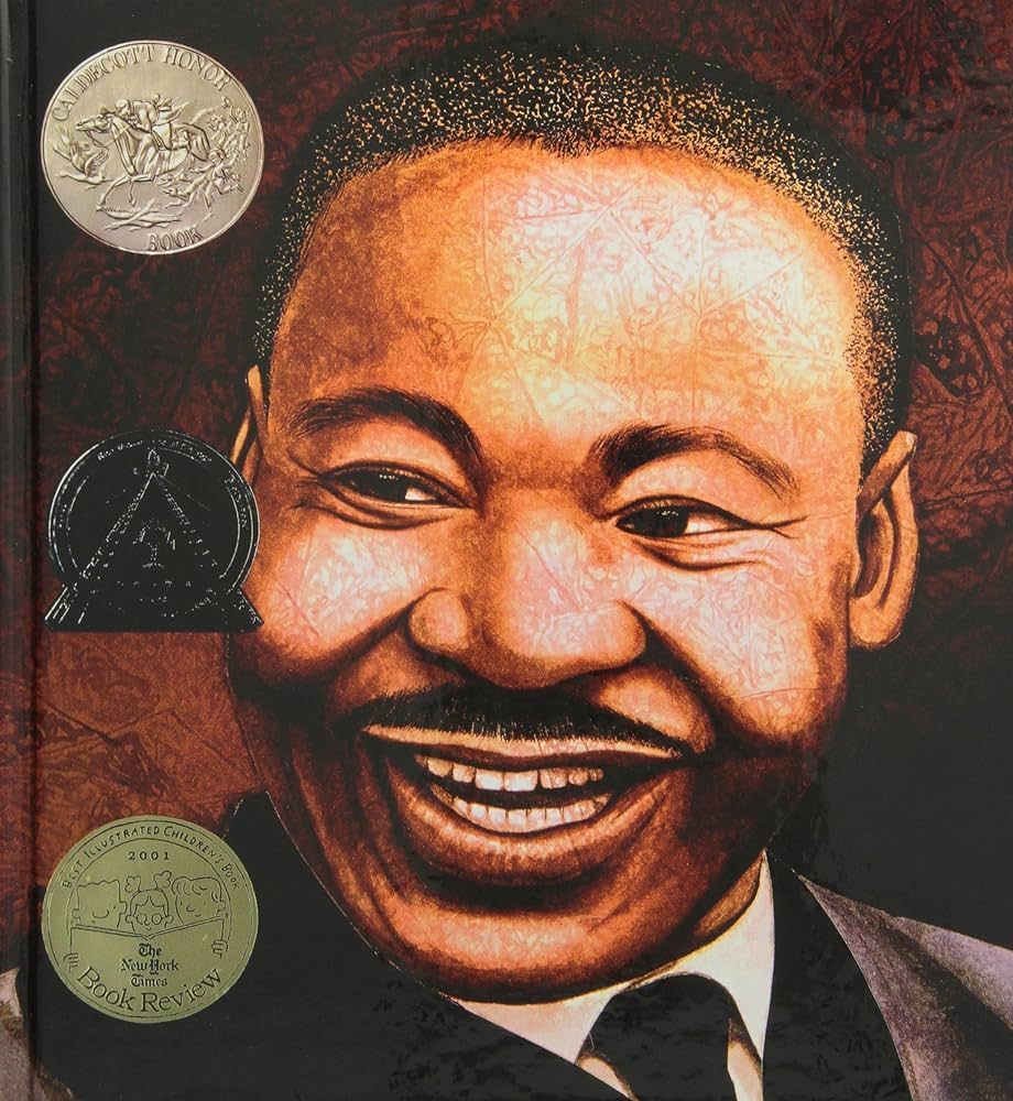 Close-up illustration of Martin Luther King Jr. smiling, book cover with awards.