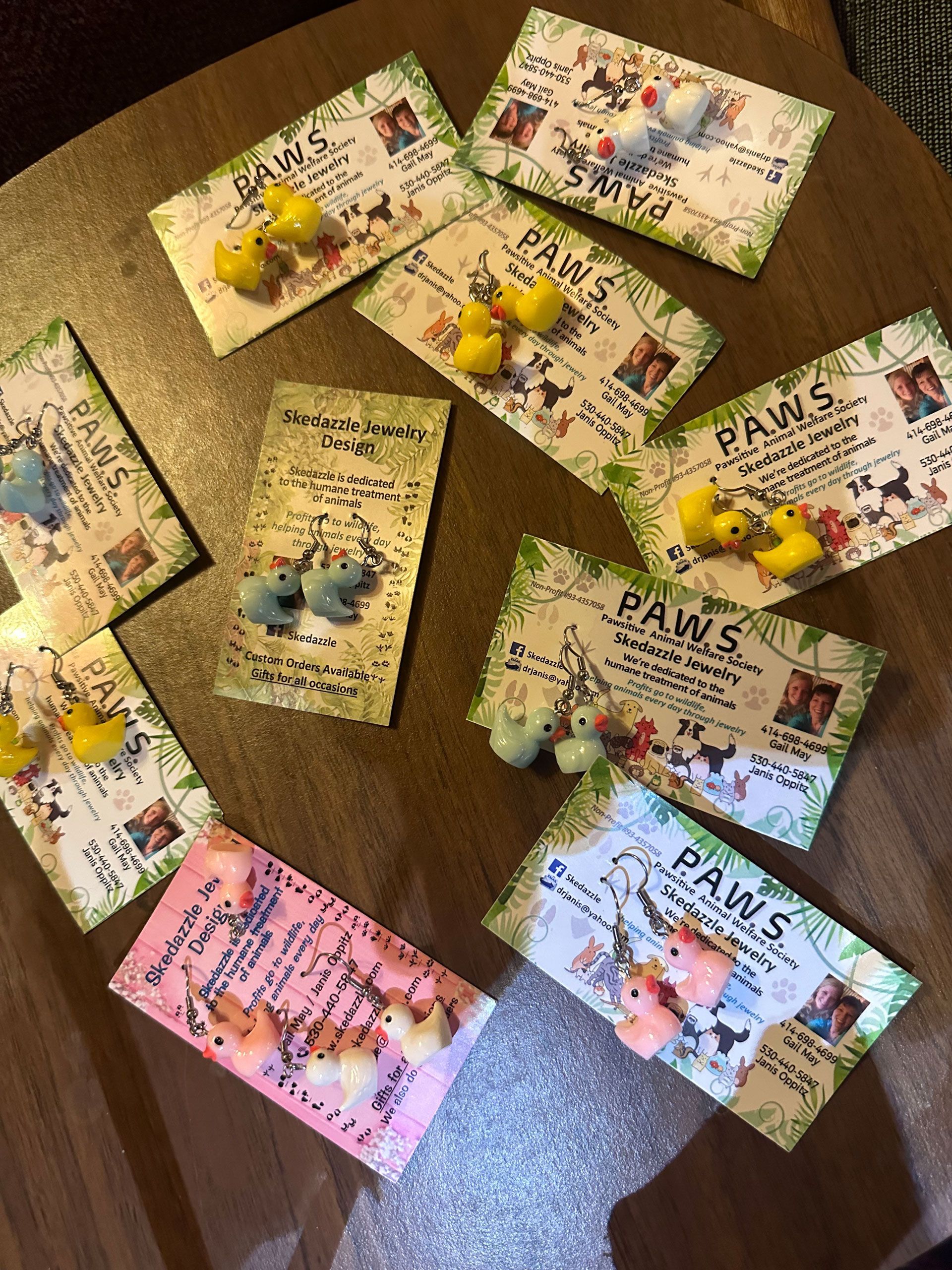 Various colorful cards decorated with animal figurines and the word