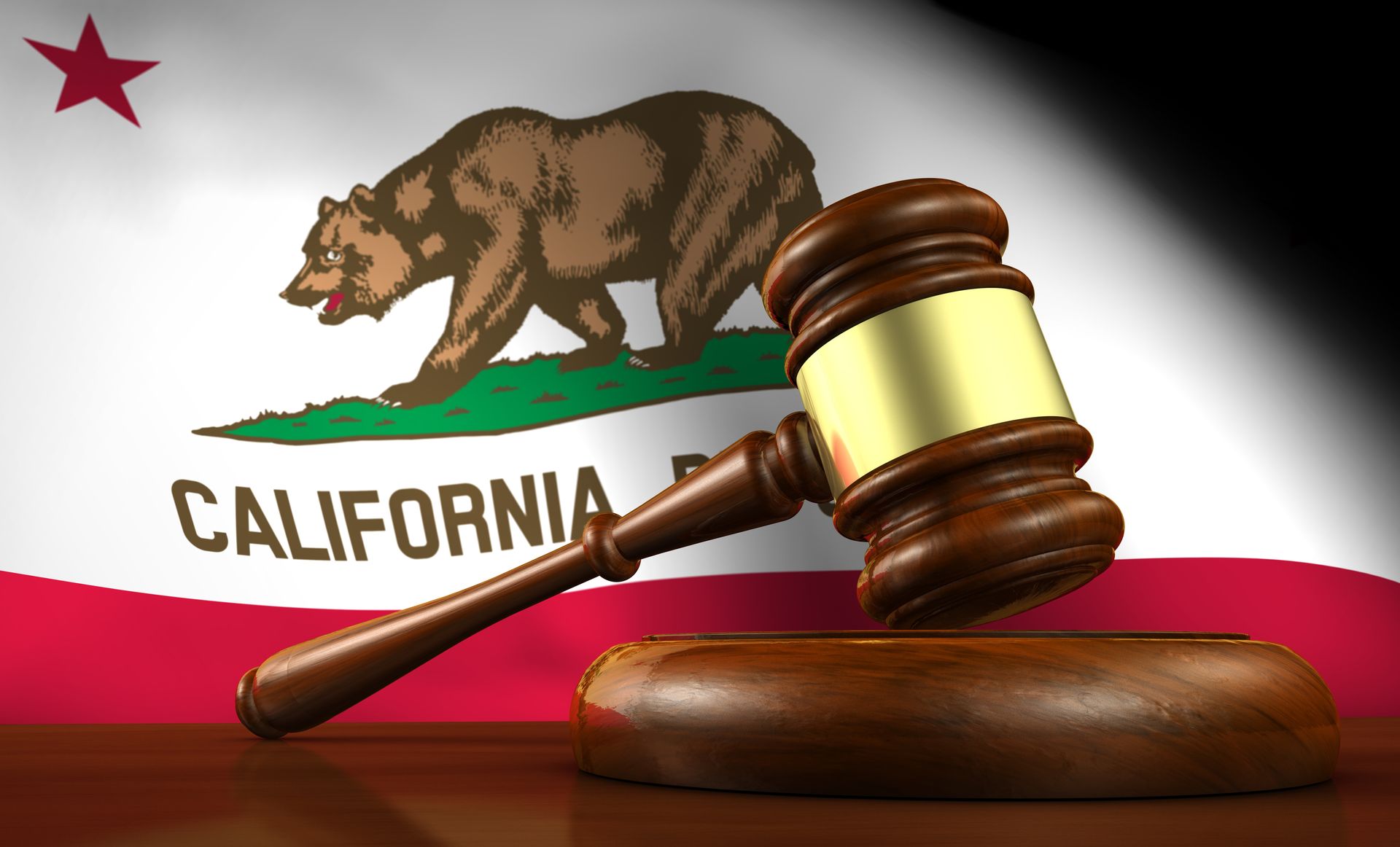 A judge 's gavel in front of a california flag