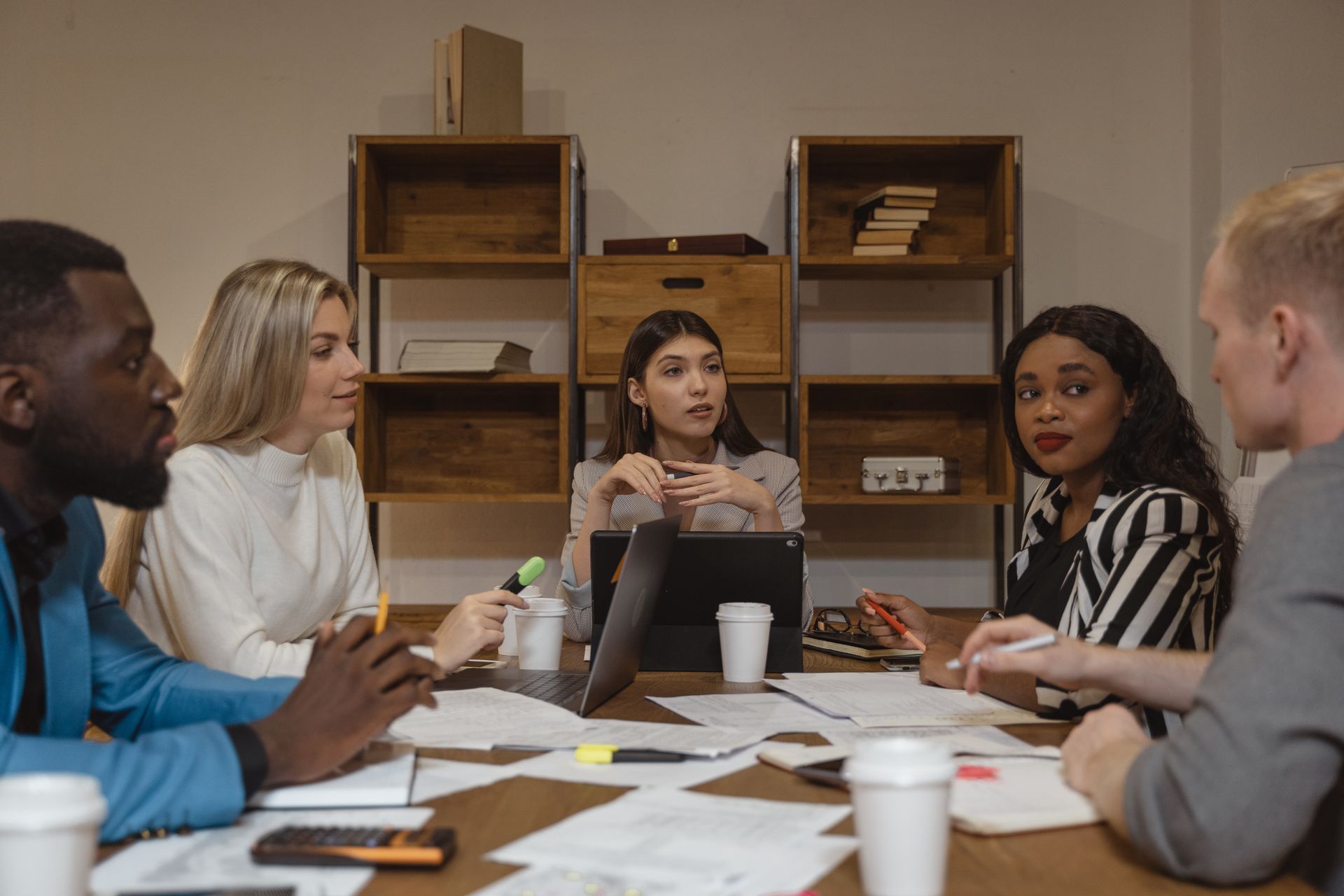 Woman leading a meeting at a conference room table