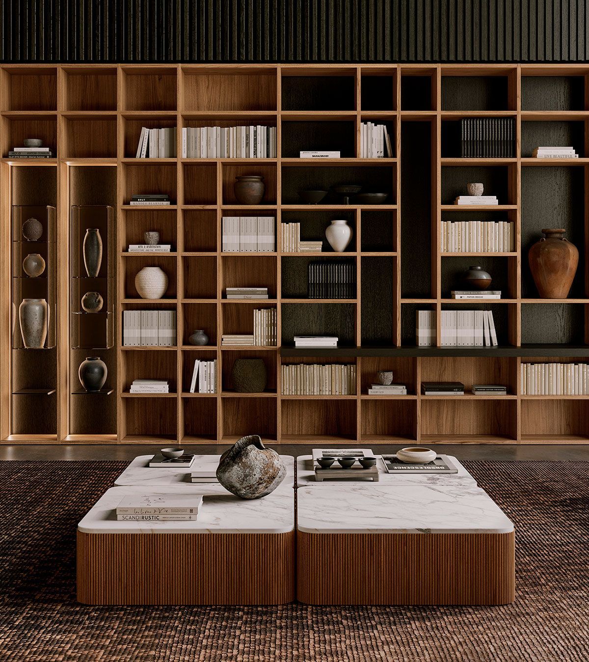 Salón moderno con pared de estanterías de madera y mesa de centro baja en tonos neutros cálidos.