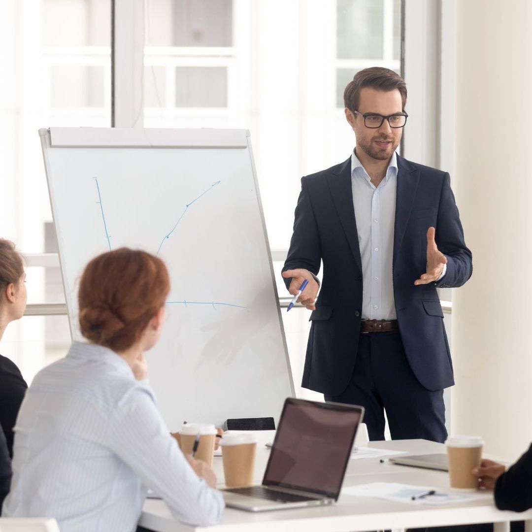 A man teaching employees
