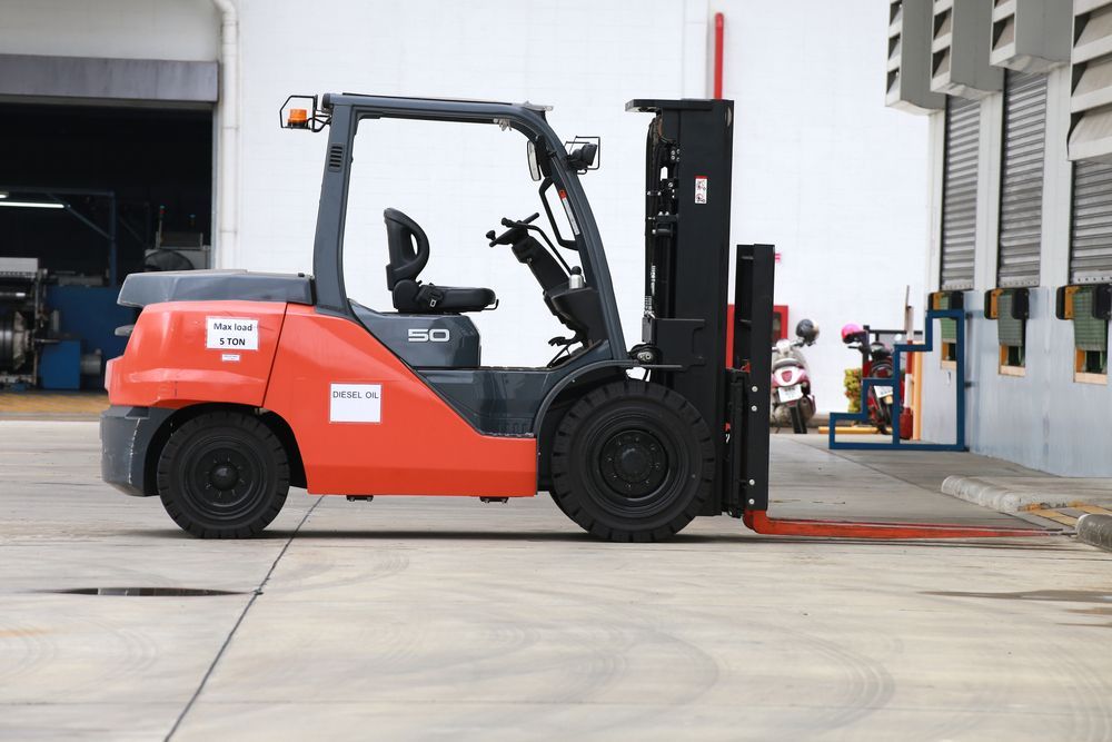Red and Grey Forklift Parked Near a Loading Dock — A1 Forklifts In Grafton, NSW