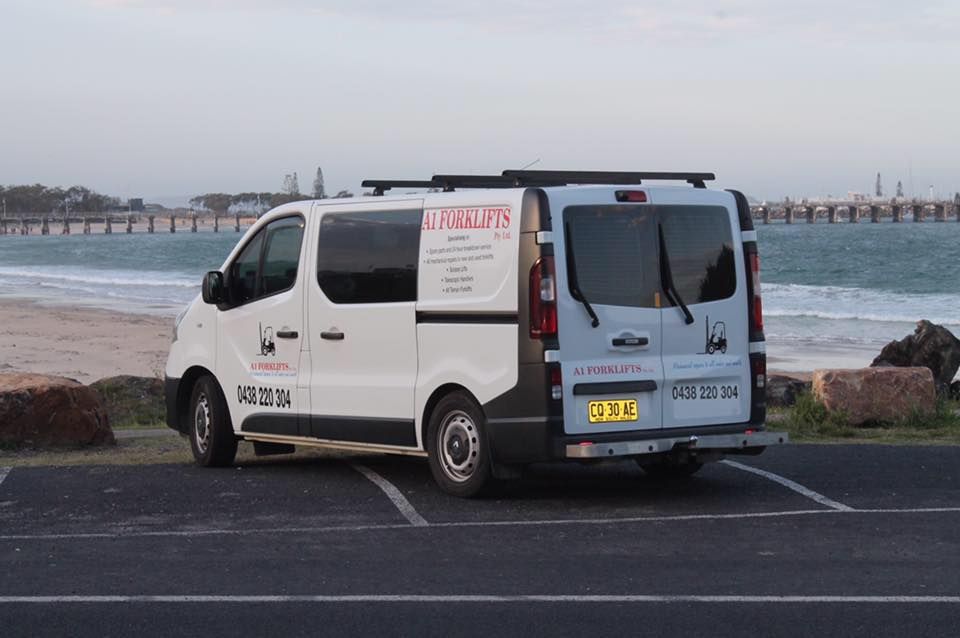 White Work Van Parked at a Beach, Facing Ocean — A1 Forklifts In Taree, NSW