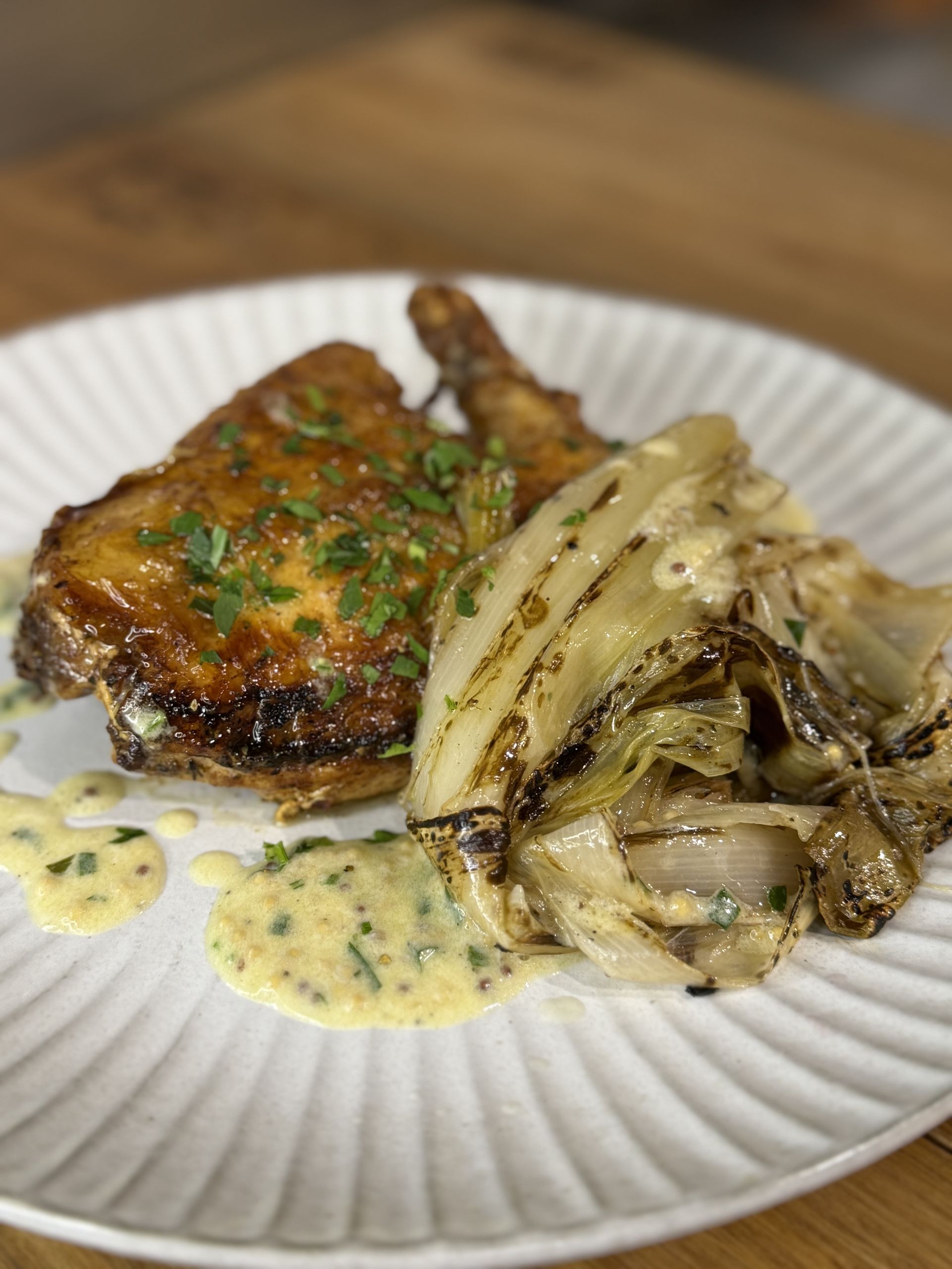 A plate with meat, onions and sauce — Onesta Cucina in Bowral, NSW
