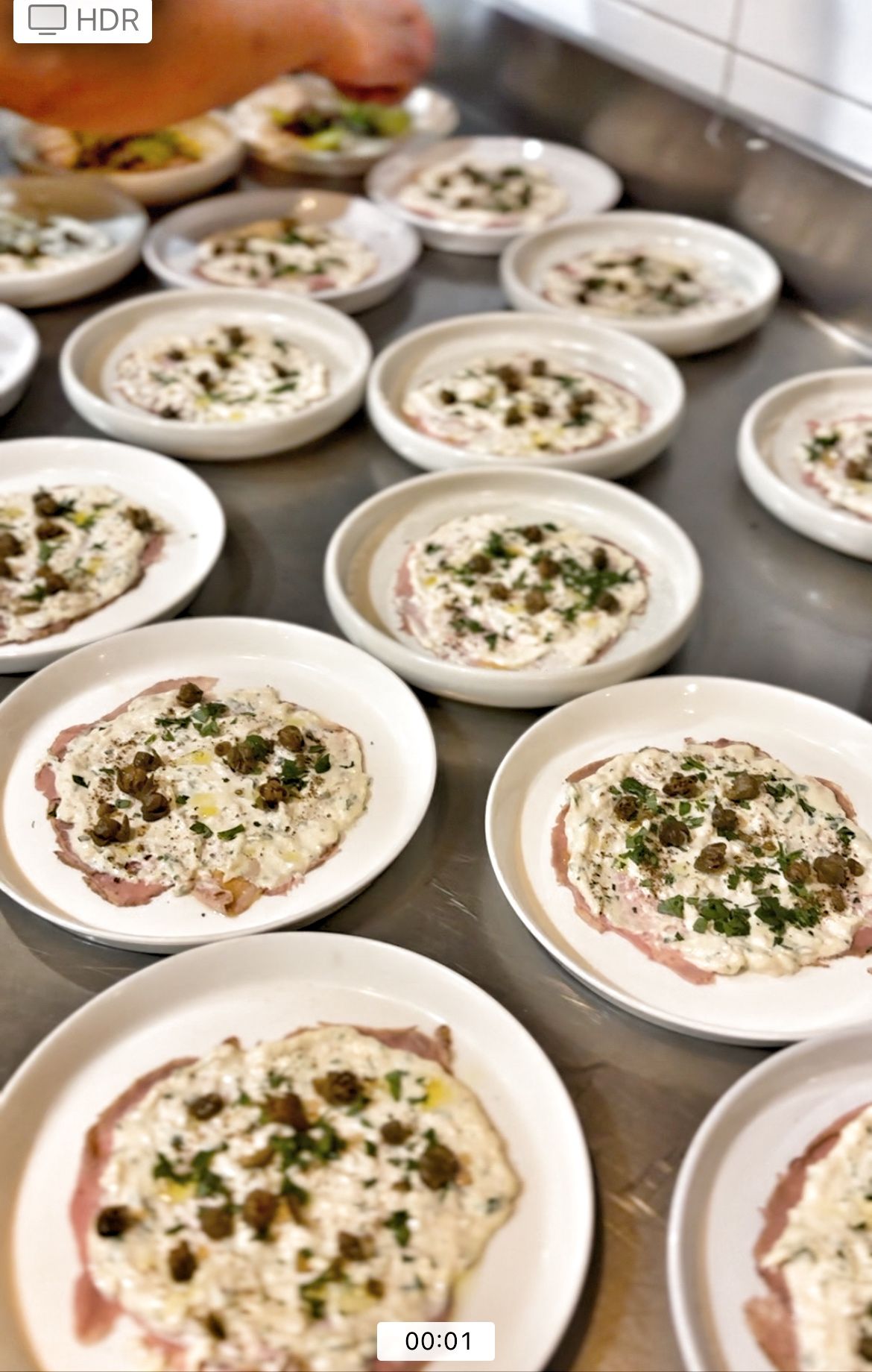 Lots of plates with food are all on a table — Onesta Cucina in Bowral, NSW
