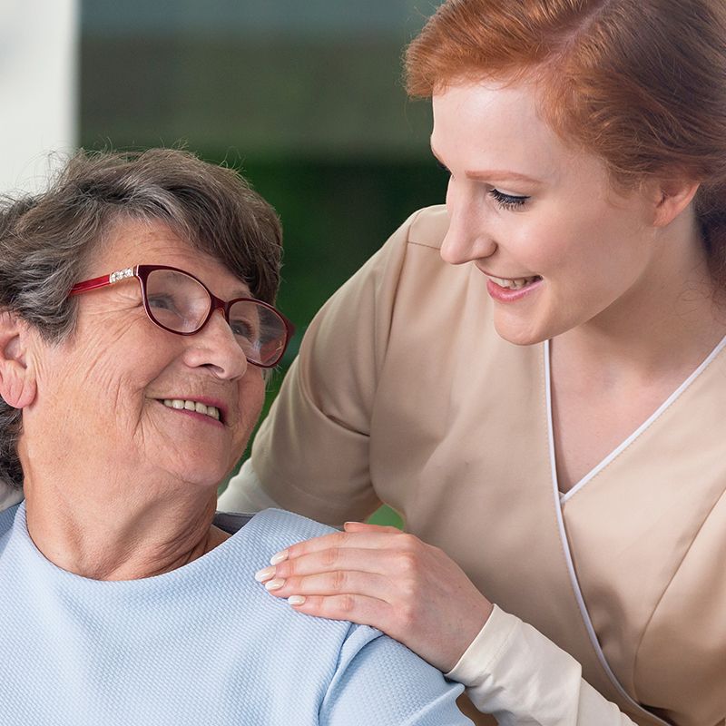 Woman Helping Elderly Woman Woman Helping Elderly Woman