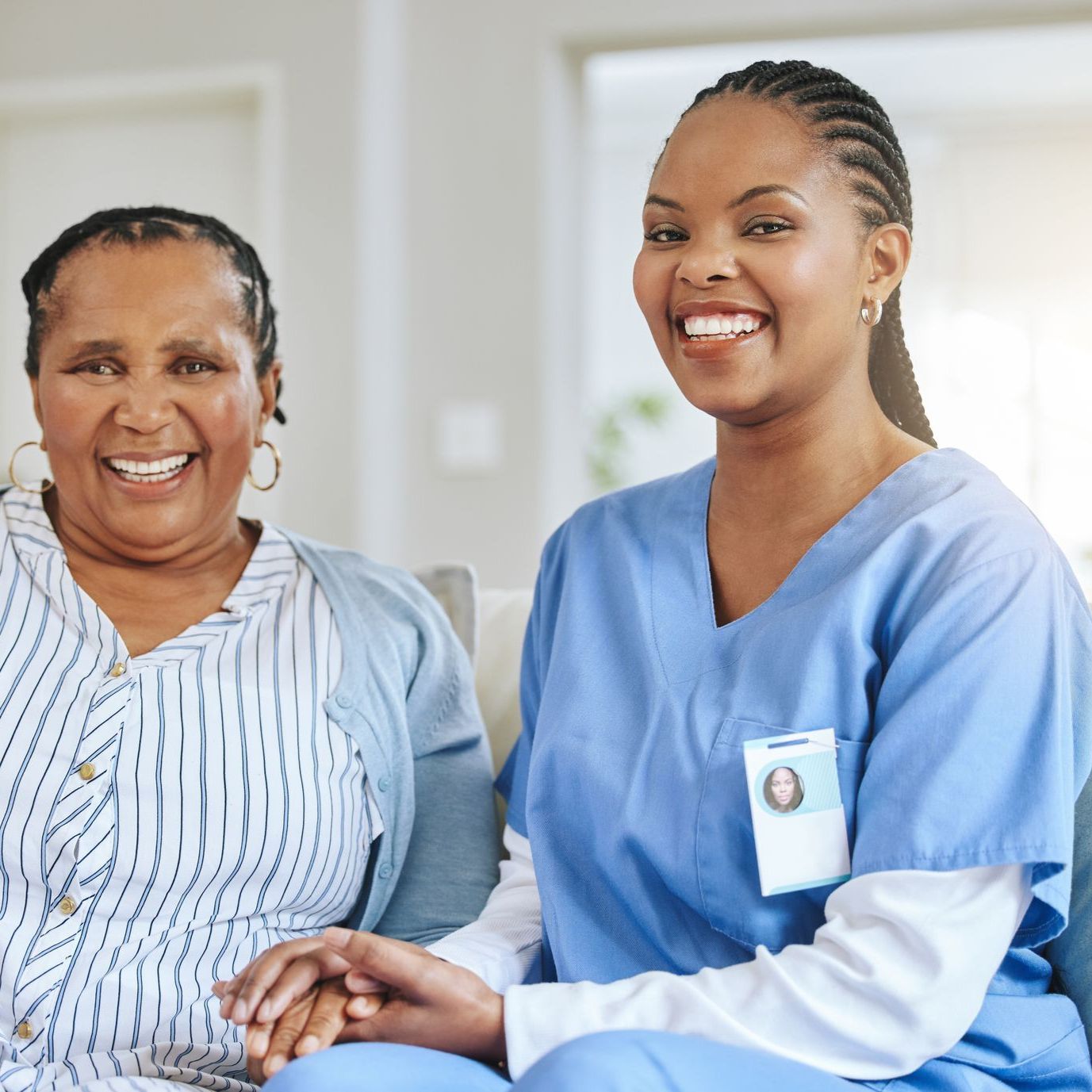 Person Helping Elder Person Using Support