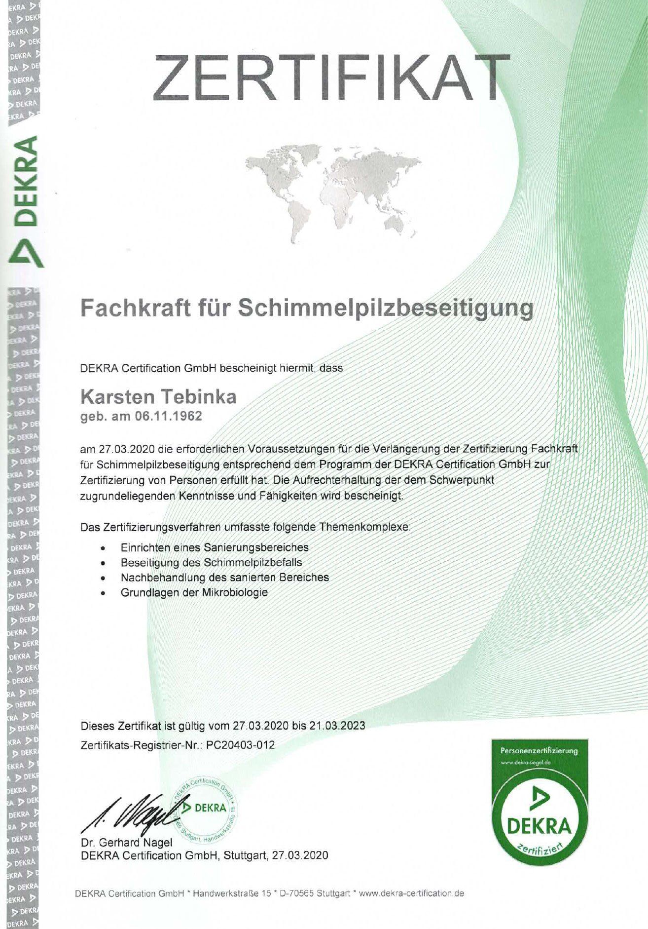 Eine grün-weiße Urkunde mit einer Weltkarte darauf.