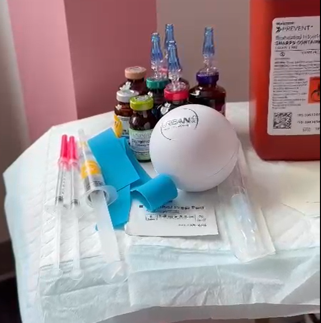 A table with Urbanrx IV Shots Ads' on it