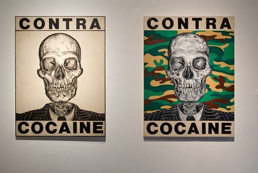 Two pictures on a white wall in Track 16 Gallery.